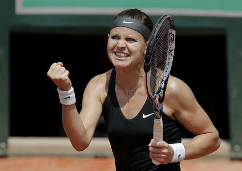 powerful: Lucie Safarova exults after defeating Ana Ivanovic in the French Open third round. reuters