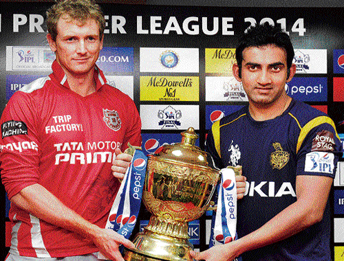 the big prize: Kings XI Punjab captain George Bailey (left) and Kolkata Knight Riders' skipper Gautam Gambhir with the IPL winners' trophy on the eve of the title decider in Bangalore. dh photo/ kishor kumar bolar