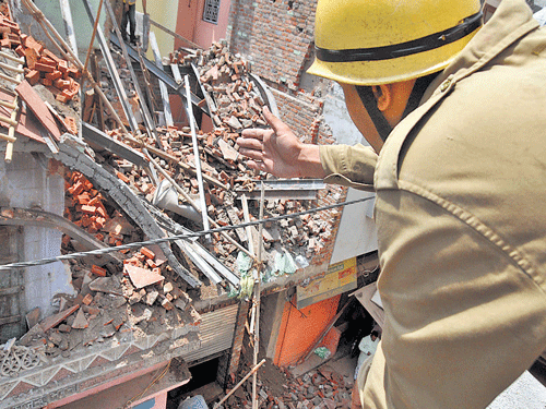 The under-construction three-storey bulding that collapsed at Sadar Bazar area in NewDelhi on Sunday. DH photo