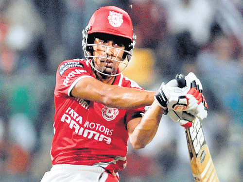 Kings XI's Wriddhiman Saha in an aggressive mood during his unbeaten 115 on Sunday. DH photo