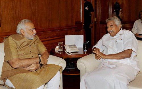 Prime Minister Narendra Modi during a meeting with Chief Minister of Kerala, Oommen Chandy in New Delhi on Monday. PTI Photo