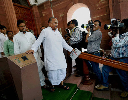 Samajwadi Party supremo Mulayam Singh Yadav with party leaders at Parliament House on the first day of first session of 16th Lok Sabha, in New Delhi on Wednesday. PTI Photo