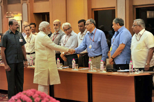 Prime Minister Narendra Modi interacts with Secretaries of the Government of India, before their meeting in New Delhi on Wednesday. PTI Photo