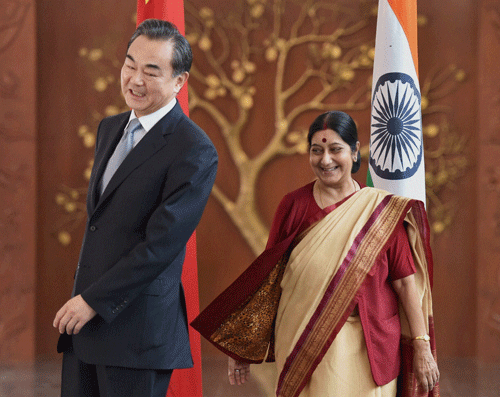 External Affairs Minister Sushma Swaraj with her Chinese counterpart, Wang Yi, before their meeting in New Delhi on Sunday. PTI Photo