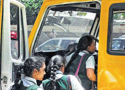 Risky: Children boarding a school bus on St Mark's Road.
