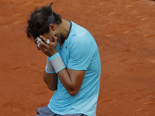 Spaniard Rafael Nadal can't hide his emotions after beating Serbian Novak Djokovic in the French Open final on Sunday. Nadal won 3-6, 7-5, 6-2, 6-4. AP