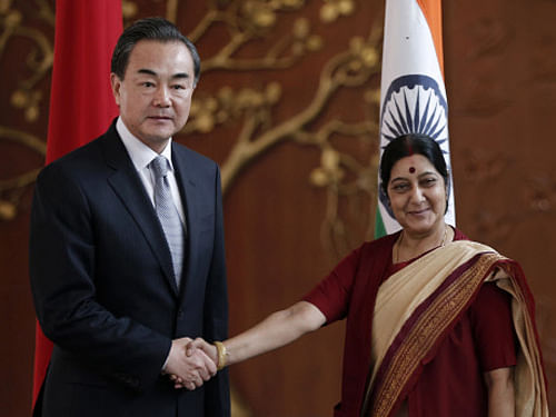 Chinese Foreign Minister Wang Yi with Minister for External Affairs Sushma Swaraj in New Delhi on Sunday. Reuters photo