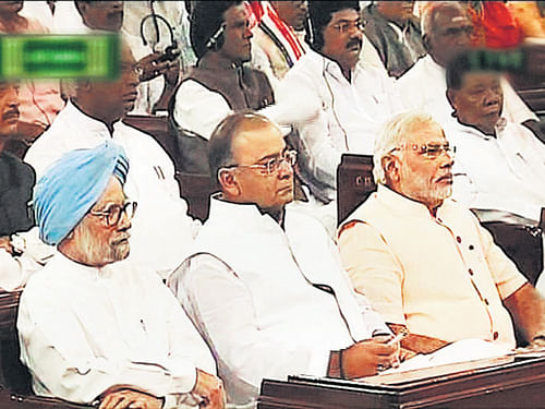 Prime Minister Narendra Modi with former prime minister Manmohan Singh and Finance Minister Arun Jaitley during President Pranab Mukherjee's address to the joint session of Parliament in New Delhi on Monday. PTI Photo