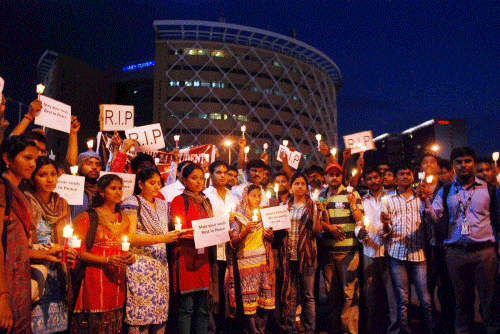 IT professionals & students take part in a candle light march for the 24 engineering students who were swept away in Beas River in Himachal Pradesh, in Hyderabad on Tuesday. PTI Photo