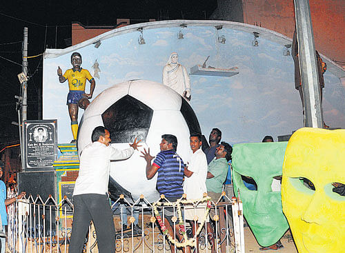 king-size: Football fans in Gautamapura near Ulsoor put up a giant ball ahead of the Football World Cup. DH photo/SHivakumar