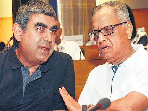 Newly appointed CEO and MD of Infosys Vishal Sikka with outgoing Executive Chairman N R Narayana Murthy at the Infosys campus in Bangalore on Thursday. KPN