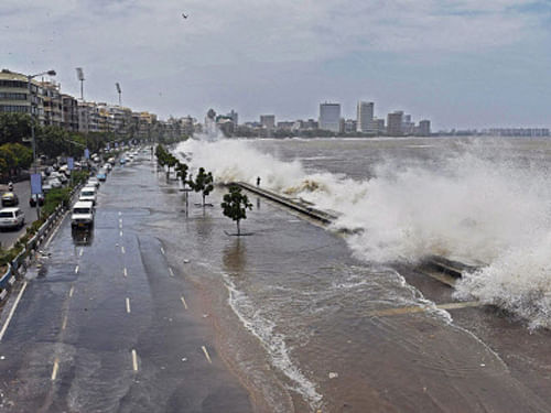 A high tide inundates Marine drive in Mumbai on Thursday. Municipal Corporation of Greater Mumbai (MCGM) has issued an alert for tidal waves higher than 4.5 metres likely to hit Mumbai shoreline this week. PTI photo