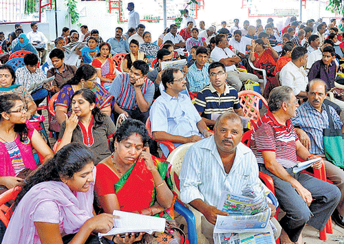 Waiting for their turn: Students along with their relatives wait to get their documents verified at the CET Cell in Malleswaram, Bangalore on Friday. KPN