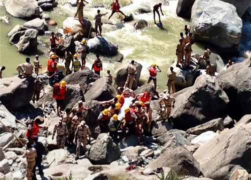 Rescue operations is carried out in Beas River in Mandi, Himachal Pradesh. PTI photo