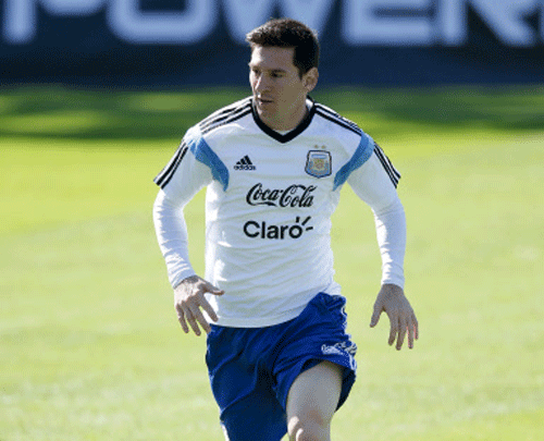 Argentina's Lionel Messi runs during a training session in Vespasiano, near Belo Horizonte, Brazil. AP photo