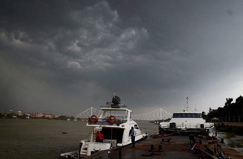 Dark clouds cover the sky before heavy rains in Kolkata on Saturday. PTI Photo