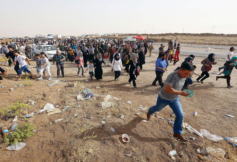 Amid escalation in violence in Iraq, India today asked its citizens not to travel to the troubled-torn country and set up a 24-hour helpline to offer assistance to those living there. AP file photo of Iraq refugees