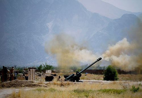 In this Wednesday, June 1, 2011, file photo, Pakistani troops fire heavy artillery toward alleged militants hideouts in the mountain ranges in Mamad Gat in Pakistan's Mohmand tribal region along the Afghan border. The Pakistani army said it has launched a 'comprehensive operation' against foreign and local militants in a tribal region near the Afghan border. An army statement issued Sunday, June 15, 2014 said the long-awaited offensive in North Waziristan was started at the direction of the government of Pakistan. AP
