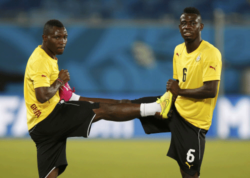 Ghana national soccer team players Afriyie Acquah (R) and Kwadwo Asamoah attend a training session at the Dunas Arena soccer stadium in Natal. Reuters photo