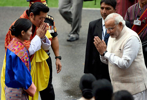 Playing down its unsuccessful bid to establish diplomatic ties with Bhutan, China today said it is glad to see New Delhi and Thimphu develop their relations further during the just-concluded visit of Prime Minister Narendra Modi. PTI photo