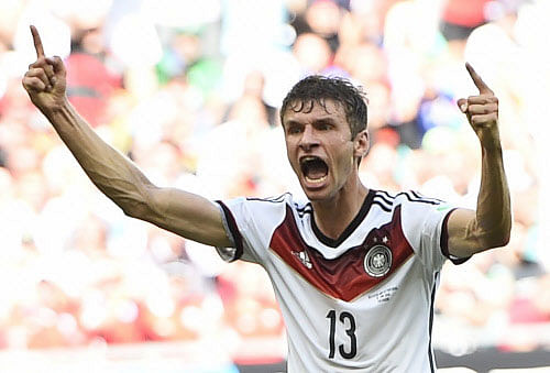 Germany's Thomas Mueller celebrates scoring his team's third goal, his second goal for the match, against Portugal during their 2014 World Cup Group G soccer match at the Fonte Nova arena in Salvador, June 16, 2014. REUTERS
