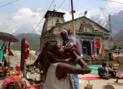 Devotees at Kedarnath Temple in Uttrakhand on Monday. The temple was devastated in a flood last year. PTI Photo