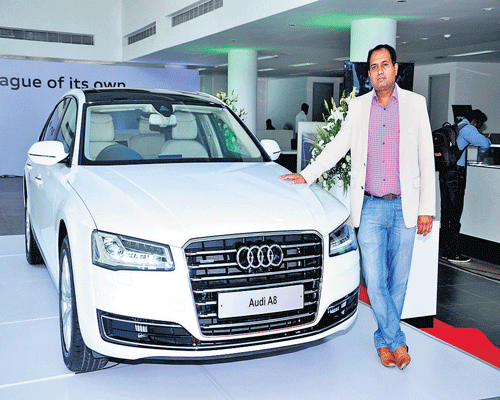 LUXURY STATEMENT: Audi India Vice-President (Operations) Gajanan Hegdekatte poses next to the Audi A8L at the launch of the luxury car in Bangalore last week.