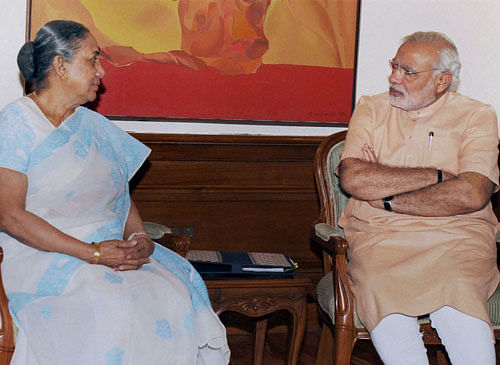 Prime Minister Narendra Modi interacts with Rajasthan Governor Margaret Alva at his 7 Race Course Road residence in New Delhi on Tuesday. PTI