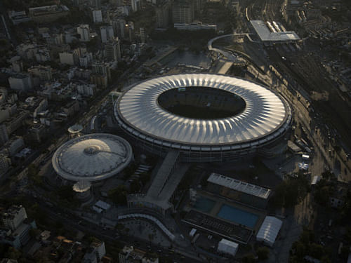 Putin will attend an event following the July 12 final in Rio de Janeiro where his Brazilian counterpart Dilma Rousseff will pass on responsibility for the tournament to the Kremlin strongman, Izvestiya daily reported, citing an unnamed government source. Aerial view of the Maracana stadium, in Rio de Janeiro where the World Cup Final match will be held. AP photo