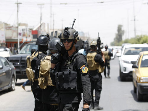 Members of the Iraqi Special Operations Forces take part in an intensive security deployment in Baghdad's Amiriya district. India Wednesday said 40 Indians working for a Turkish construction company have been abducted in violence-hit Iraq's Mosul area which has been taken over by Sunni militants. Reuters photo
