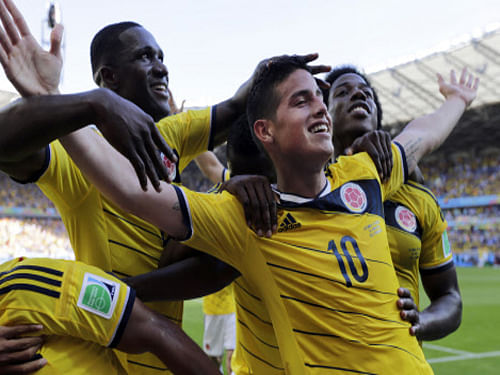 Colombia's James Rodriguez, celebrates with his teammates after scoring his side's third goal during the group C World Cup soccer match against Greece. AP file photo
