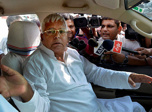 RJD chief Lalu Prasad  addresses a press conference in Patna on Wednesday. PTI