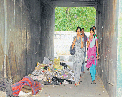 The pedestrian underpass at Palace Guttahalli is turning into a dump yard. DH Photos by SK Dinesh
