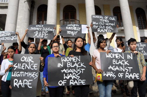 Bengaluru: Activists of Women in Black protest against rape on women, in Bengaluru on Thursday. PTI Photo