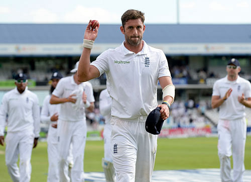 second cricket test match against Sri Lanka at Headingley cricket ground in Leeds England's Liam Plunkett holds the ball up as he leaves the field after taking five wickets during the second cricket test match against Sri Lanka at Headingley cricket ground in Leeds, England June 20, 2014. REUTERS