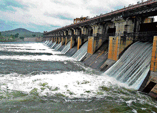 Water was released from the eight crest gates of Tunga dam at Gajnur near Shimoga on Friday. DH PHOTO