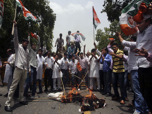 Congress workers, led by the chief of the party's Delhi unit Arvinder Singh Lovely, Saturday protested here against the Modi government's decision to hike rail fares. AP photo