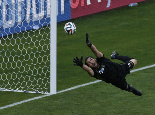 Iran's goalkeeper Haghighi fails to save a goal by Argentina's Messi  Reuters photo