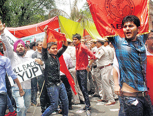 ABVP activists protest against the four-year undergraduate programme (FYUP) of Delhi University in New Delhi on Saturday. PTI photo