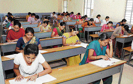 Candidates writing the Karnataka Teachers' Eligibility Test (KARTET) in Bangalore on Sunday. DH photo