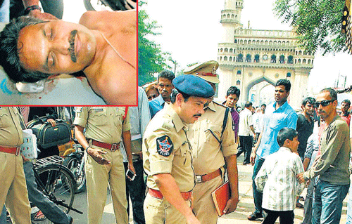 Police carry out investigations at a spot near Char Minar where a DRDO official (inset) was stabbed in Hyderbad on Sunday. PTI photo