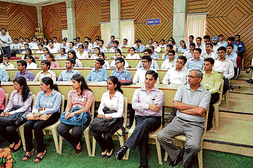 Students listen in attention as faculty and corporate honchos deliver lectures.