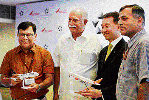 Civil Aviation Minister Ashok Gajapathi Raju (second left) with Air India CMD Rohit Nandan and Star Alliance COO Jeffrey Goh in New Delhi on Tuesday. PTI