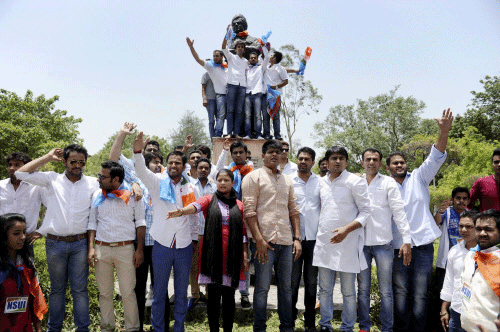 NSUI activists shout slogans during a protest over controversial FYUP at Delhi University campus on Tuesday. PTI Photo