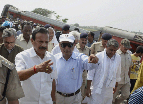 Railways Minister D.V. Sadananda Gowda visits the site of derailed Delhi-Dibrugarh Rajdhani Express near Chapra in Bihar on Wednesday. PTI photo