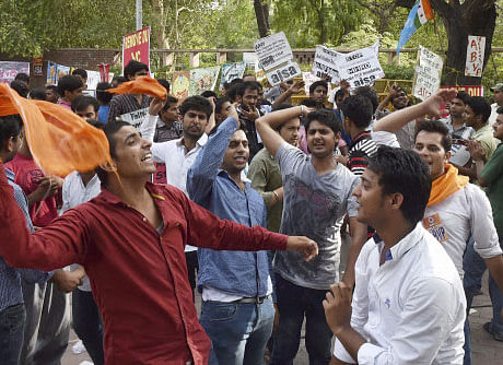 Students shout slogans during a protest over controversial FYUP at Delhi University campus on Tuesday. PTI Photo