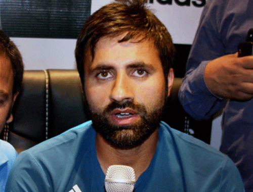Indian Cricketer Parvez Rasool addressing media during the inauguration of first sports brand 'adidas' in valley, at Jahangeer Chowk in Srinagar on Thursday. PTI Photo