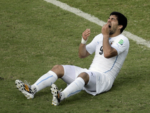 Uruguay striker Luis Suarez was banned for nine matches by FIFA on Thursday after being found guilty of biting Italian defender Giorgio Chiellini. AP file photo