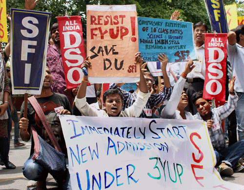 SFI activists protest against the four-year undergraduate programme (FYUP) of Delhi University in New Delhi on Thursday. Delhi University has agreed to revert to a three-year undergraduate course it replaced with a four-year programme last year, an official said Friday. PTI Photo