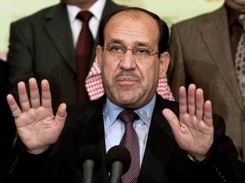 In this Friday, March 26, 2010, file photo, Iraqi Prime Minister Nouri al-Maliki speaks to the press in Baghdad, Iraq. Iraq's Vice President Khudeir al-Khuzaie called on parliament to convene on Tuesday, July 1, 2014, taking the first step toward forming a new government to present a united front against a rapidly advancing Sunni insurgency while Britain's top diplomat started an official visit to the country to urge the country's leaders to put their differences aside for the good of the nation. Al-Maliki's political bloc won the most seats in April 30 elections, but he needs support from other blocs to govern with a majority. His efforts to form a coalition have been complicated by the current crisis as critics blame his failure to promote national reconciliation for the Sunni anger fueling the insurgent gains and want him to step down.  AP